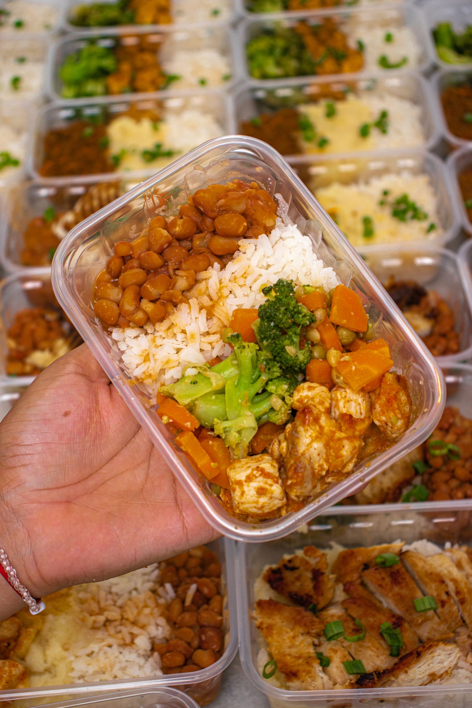 Balanced meal prep container with rice, protein, and vegetables — representative of the personalized meal targets used in coaching